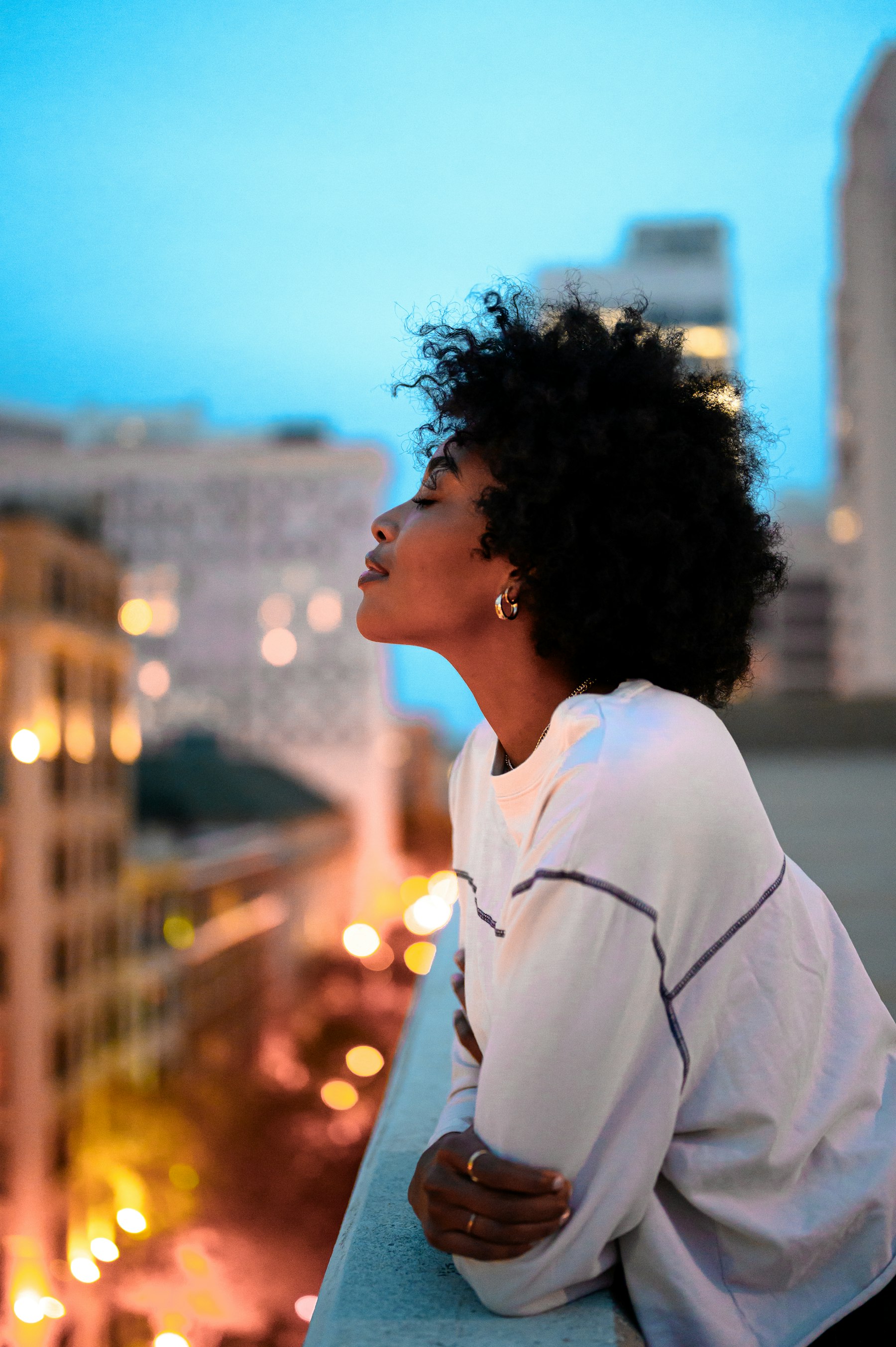 Margaux Ilunga on a rooftop at dusk